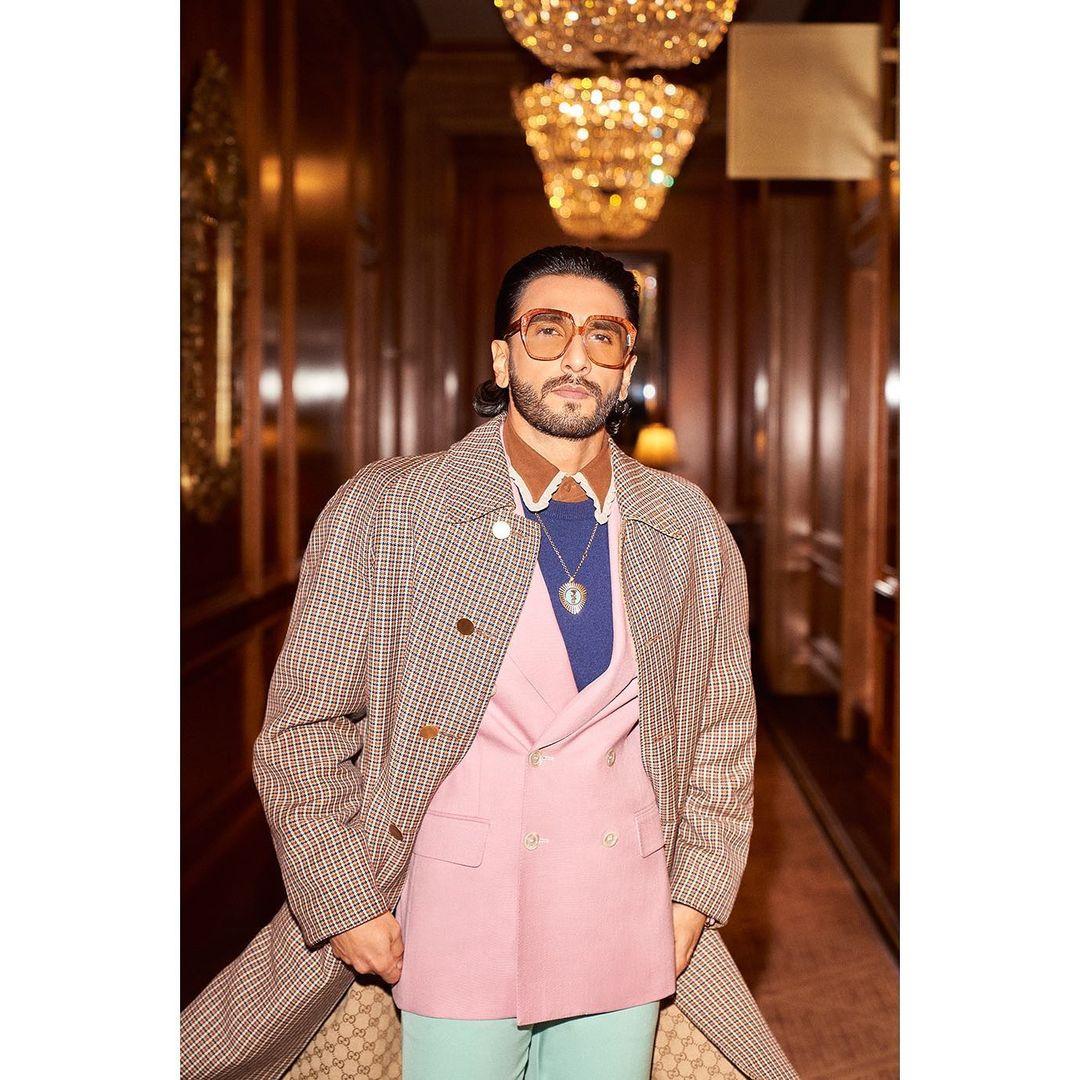 This was all harmoniously paired with slicked-back hair and statement brown glasses. Ranveer's innate ability to mix and match different elements showcases his boldness and creativity in the world of fashion.